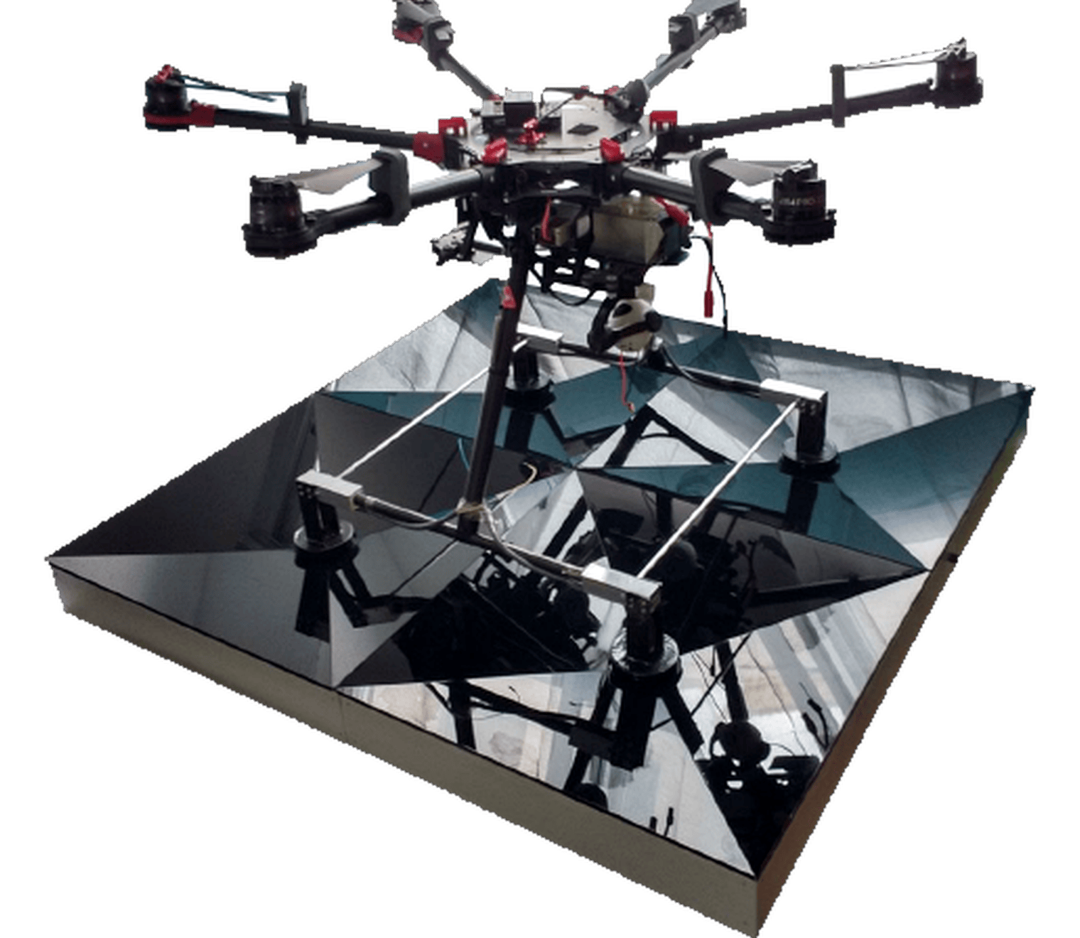 Divisek wireless charging station with an industrial drone positioned above the landing platform